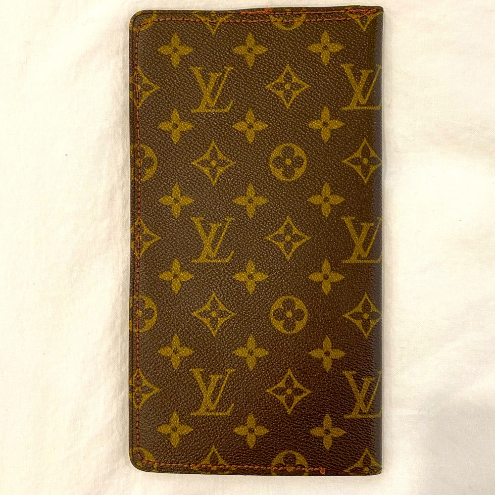Vintage Louis Vuitton wallet.  9.5” x 5.5”